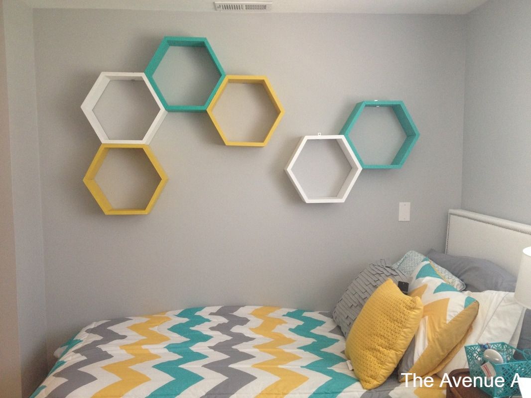 Gray wall teenage girl bedroom with teal blue, mustard yellow accent with chevron bedding and hexagon shelves 
